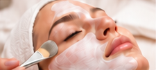 Facial mask application with a soft brush